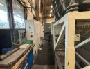 Interior of Industrial Workshop With Machinery and Workbench