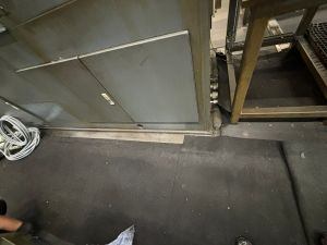 Industrial Equipment with Wiring and Flooring in a Factory Setting