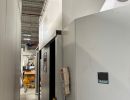 Industrial machinery in a factory with control panel and equipment