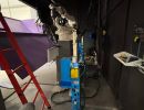 Industrial Robotics Setup with Mechanical Equipment in a Workshop Environment