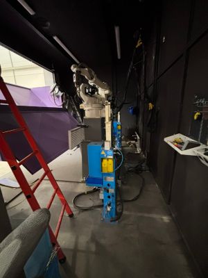Industrial Robotics Setup with Mechanical Equipment in a Workshop Environment