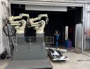 Industrial Setup Featuring Advanced Robotic Arms in a Modern Factory Setting