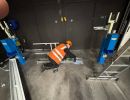 Technician Working on Industrial Equipment in a Workshop Environment