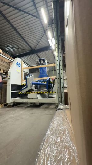 Industrial Machinery in Warehouse with Stacked Materials and Protective Covering
